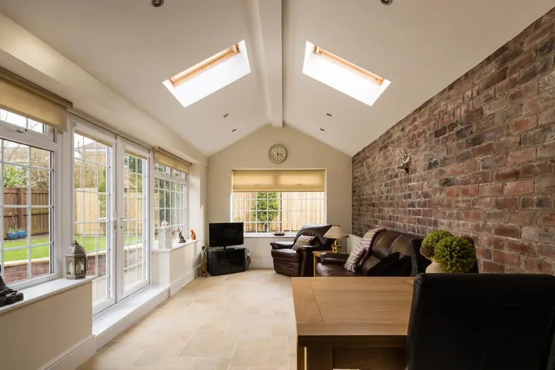 Single-storey extension with a vaulted ceiling, roof windows and doors to the garden